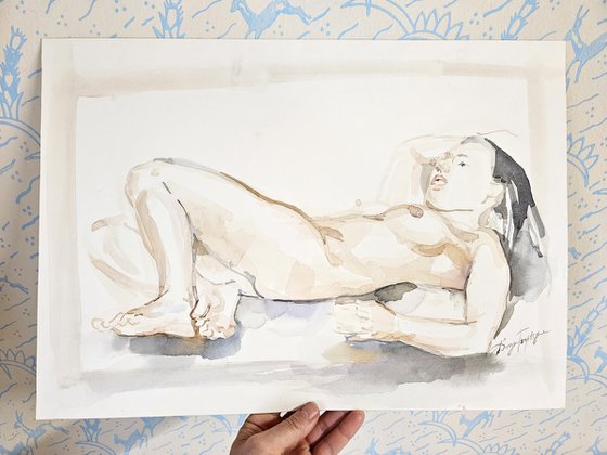 Female Nude reclining on pillows