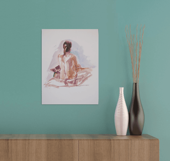 Seated female nude back view