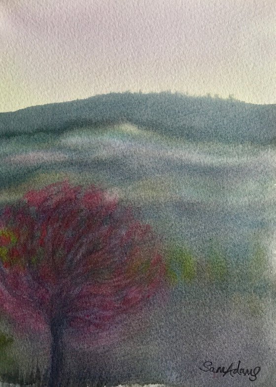 Blossom tree below the hill