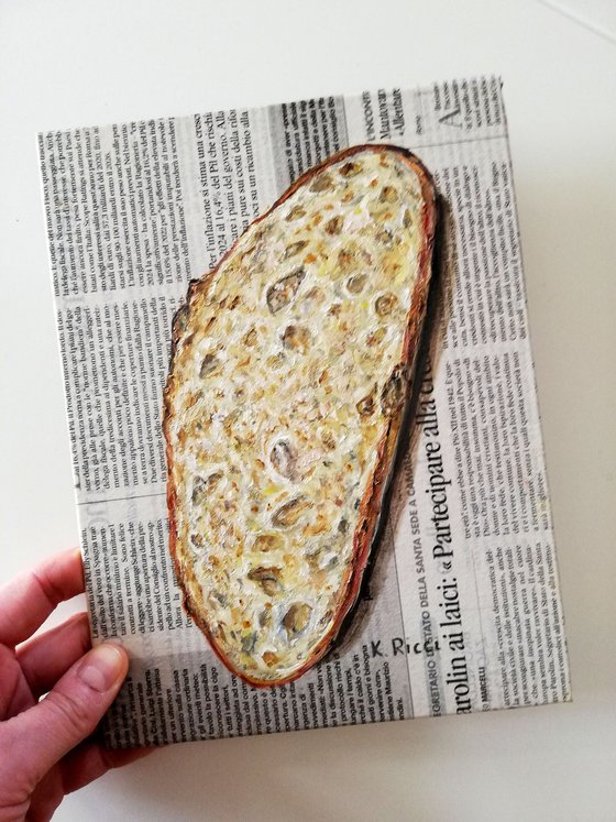 "Bread Slice on Newspaper"