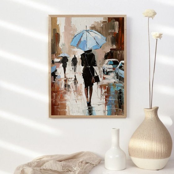 Woman with umbrella in a rainy city.