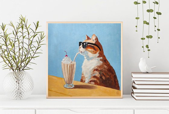 Cat drinking a milkshake