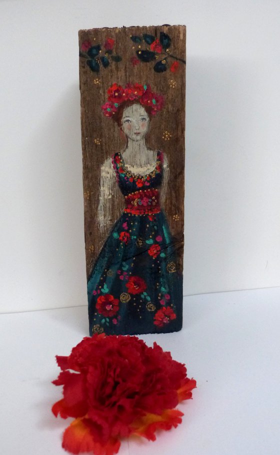 Totem sculpture Slavic woman on painted wood.