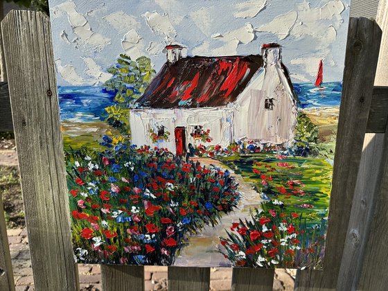 Old house with red flowers
