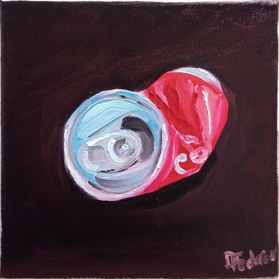 Still life with a crushed cola can