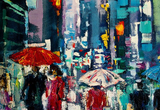 "Night city lights" ,  people with umbrellas