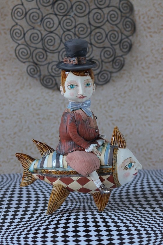 Vintage dressed boy riding the fish. From "Le Carousel, Hommage à l'Innocence" project by Elya Yalonetski