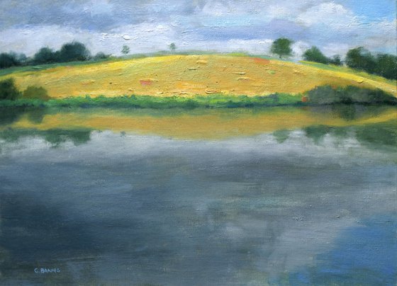 Hay Bale Field across the Reservoir, England