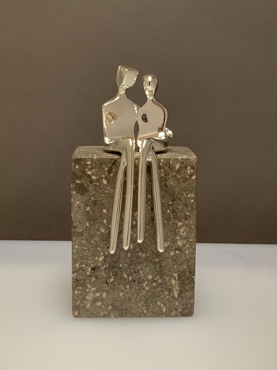 Caress a small silver plated sculpture of a loving couple by Yenny Cocq