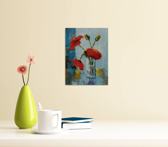 Red poppy in glass