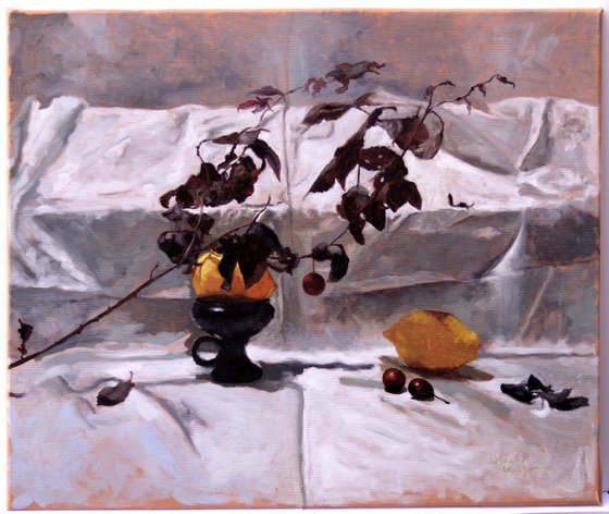 Composition with two lemons and a plum twig