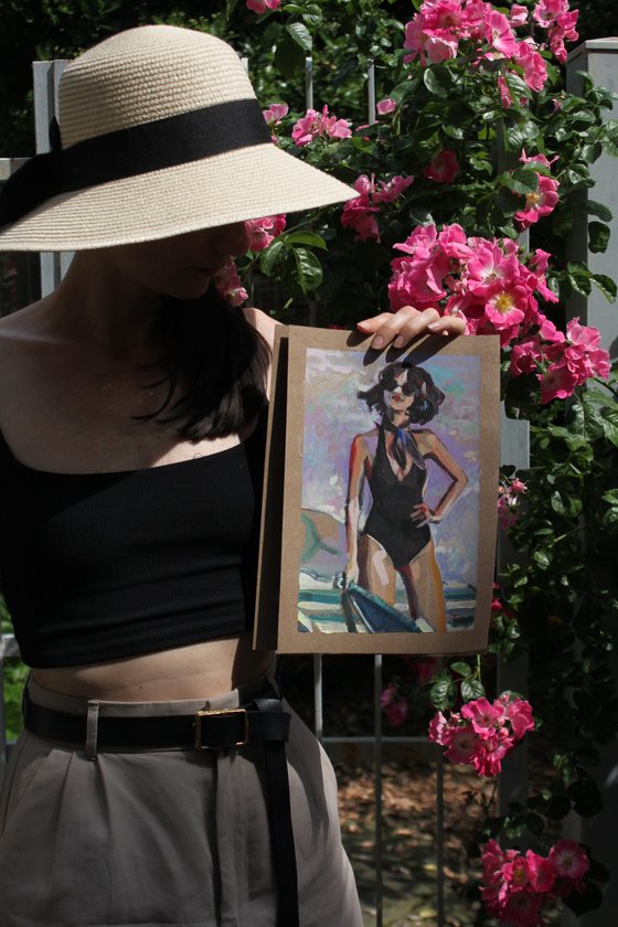 Girl in a black swimsuit On the beach