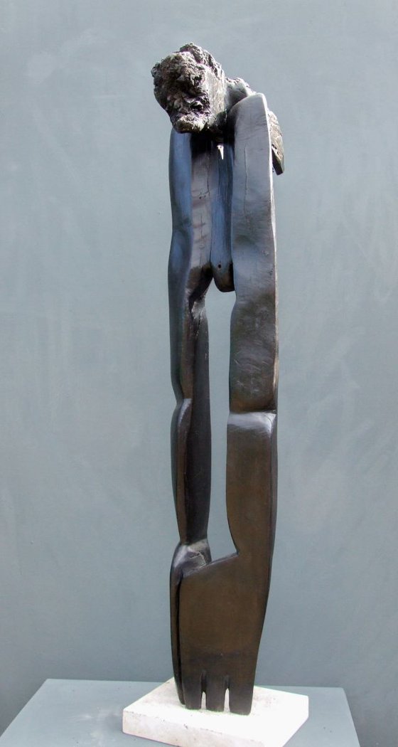"The Flower Picker" (walking through a landmine field) Bog Oak wood carving, from the series ----- Fossilized Wood