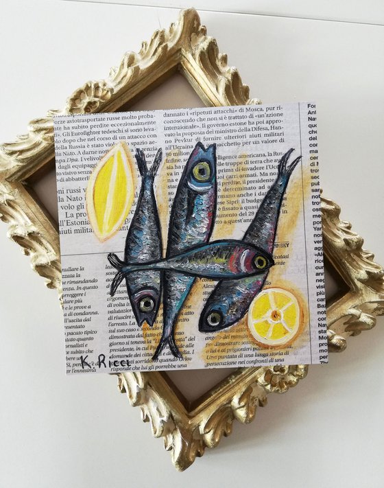 Fishes with Lemon on Newspaper