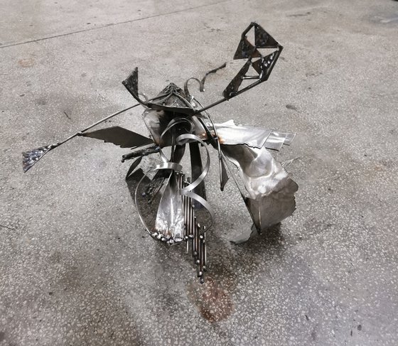 Unique welded iron sculpture beautiful space effects Star bird following the energy trail or her half signed O KLOSKA