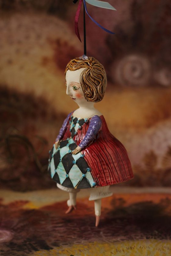 Little girl in red dress. Hanging sculpture, bell doll by Elya Yalonetski