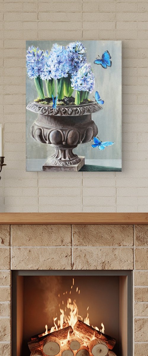 Floral acrylic blue hyacinths in vase by SoNata Art. Natasha Sokolnikova, a Moldova-born artist based in Munich, Germany, blends classical training from the School of Fine Arts with contemporary influences from global travels. Her vibrant watercolors and acrylics explore themes of love, feminine identity, and nature's symbolism—flowers representing womanhood, animals evoking human connections. Inspired by color's emotional power, her works invite viewers into a dialogue of beauty and inspiration. Achievements include representing Moldova in 'Reflections for Change' and being the first Moldovan in the Lunar Codex Project, with 'Crystal Chimes' launching to the Moon. Collected worldwide, her art speaks multiple languages of emotion