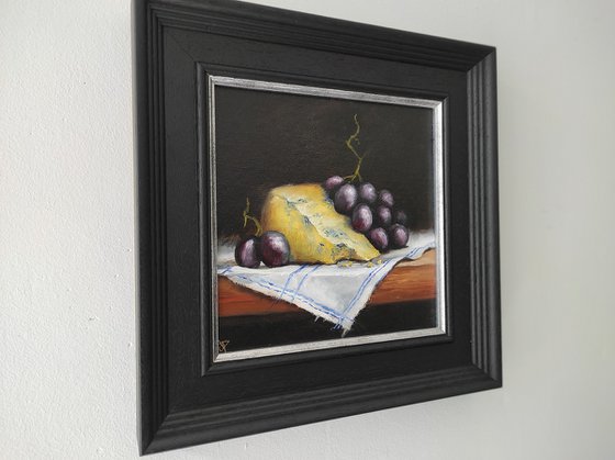 Cheese and grapes still life