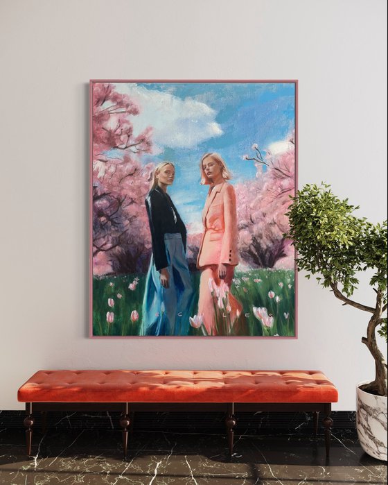 Spring, a colorful large oil painting of two fashion models in a field of tulips, surrounded by blossom trees.