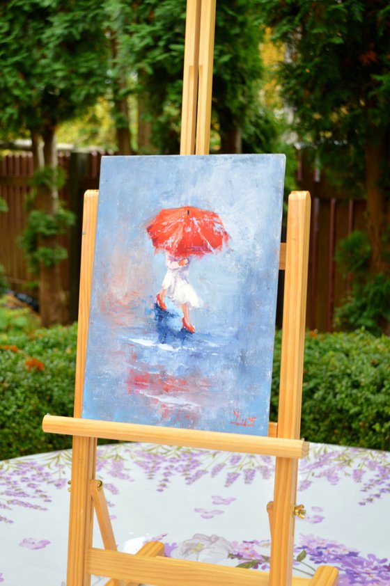 A girl running through puddles