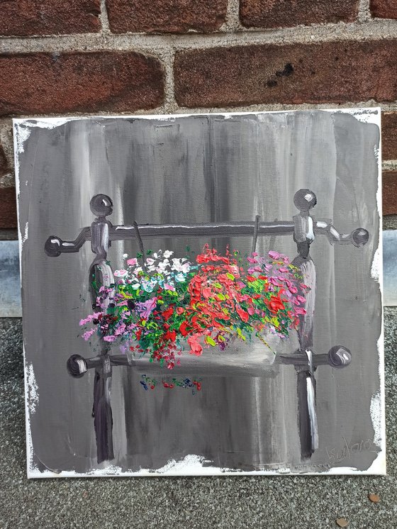 The flowers in the pot by the entrance. Plein air painting