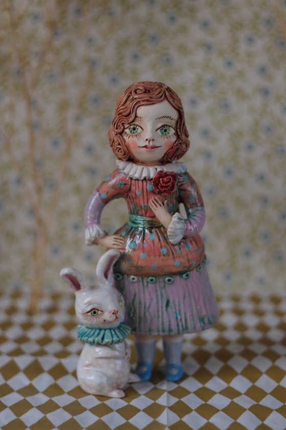 Vintage dressed girl with a rabbit