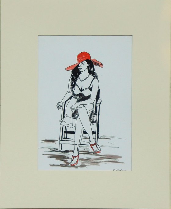 Woman in a red hat, sitting on a chair.