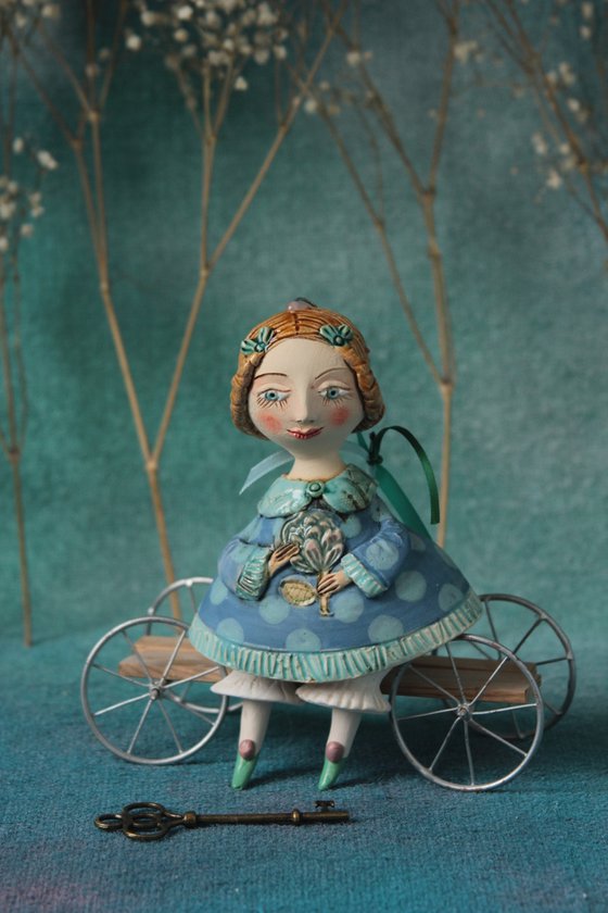 Little Girl in tender blue dress. Hanging sculpture, bell doll by Elya Yalonetski