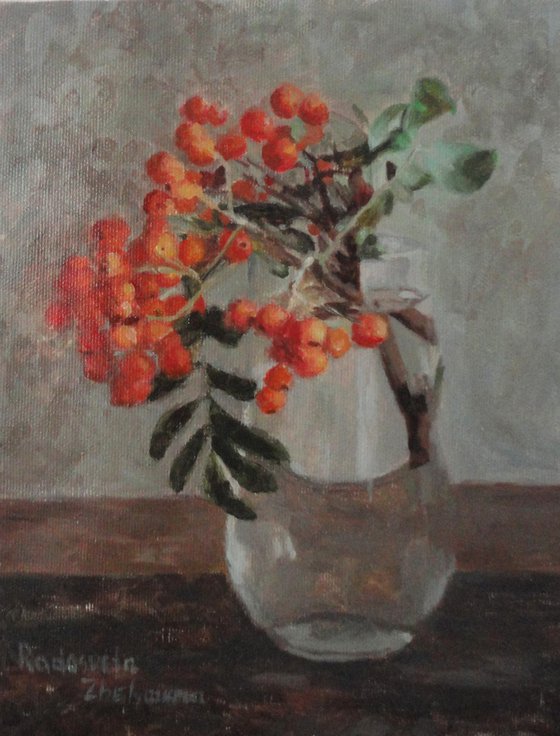 Red fruits in a vase