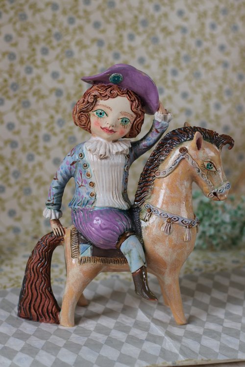 Vintage dressed boy riding a horse. by Elya Yalonetski