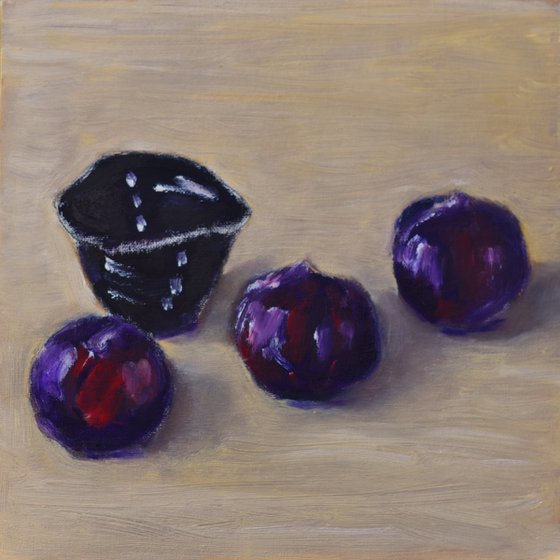 Three plums with japanese tea cup