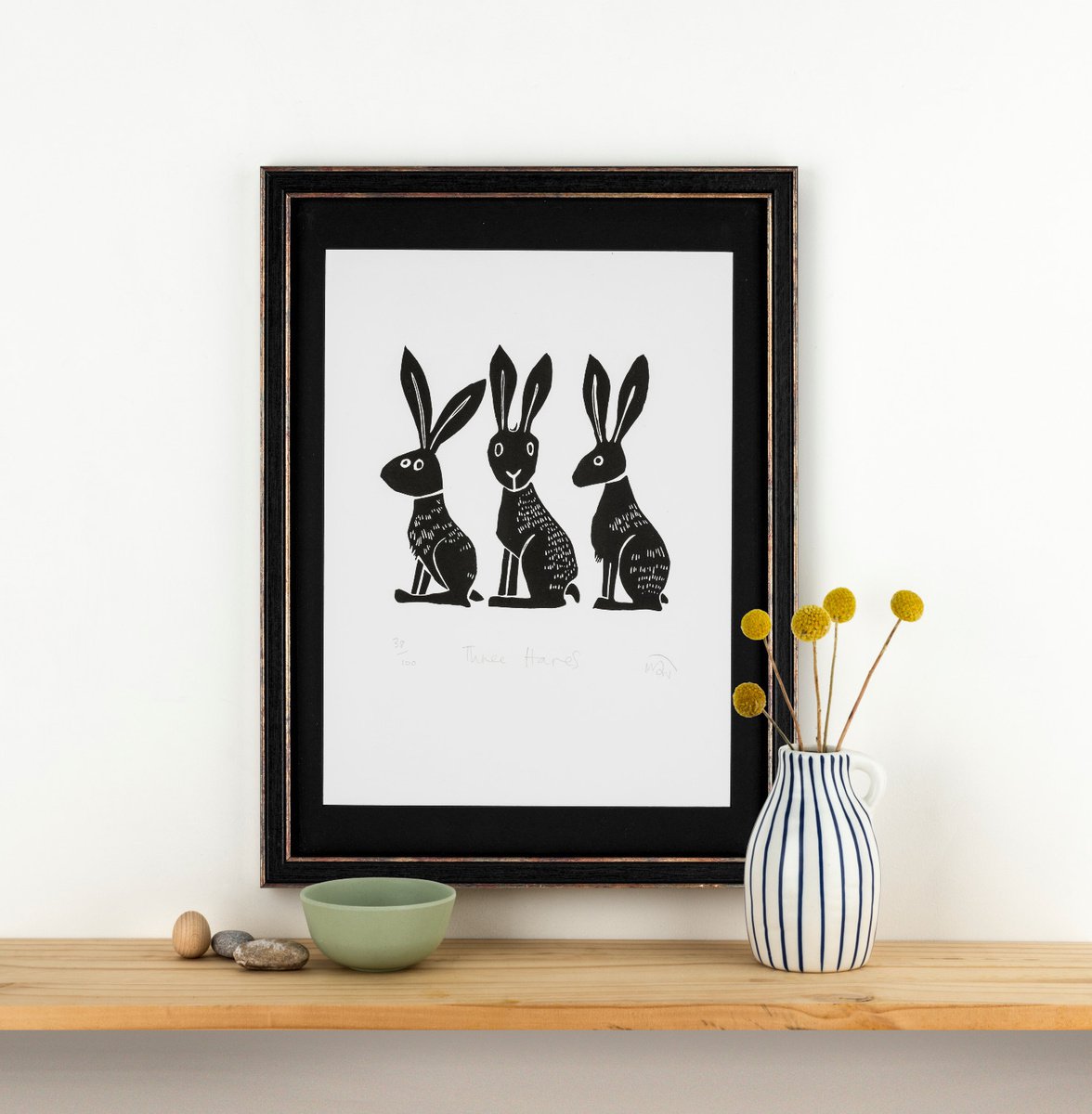 Three Hares - lino cut print by Melanie Wickham