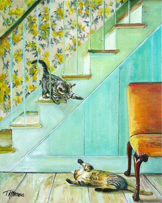 Kittens playing on the stairs