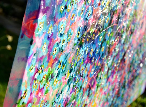 Forget me not flower field at sunrise