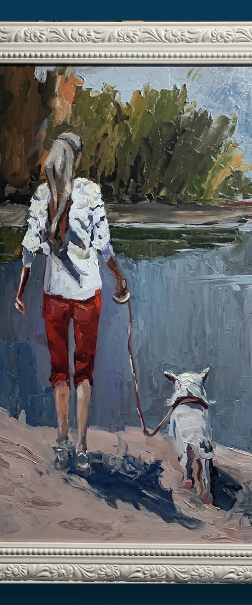 Woman walking with a dog. by Vita Schagen