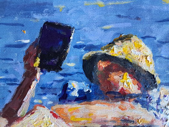 Pad reading sunbathers