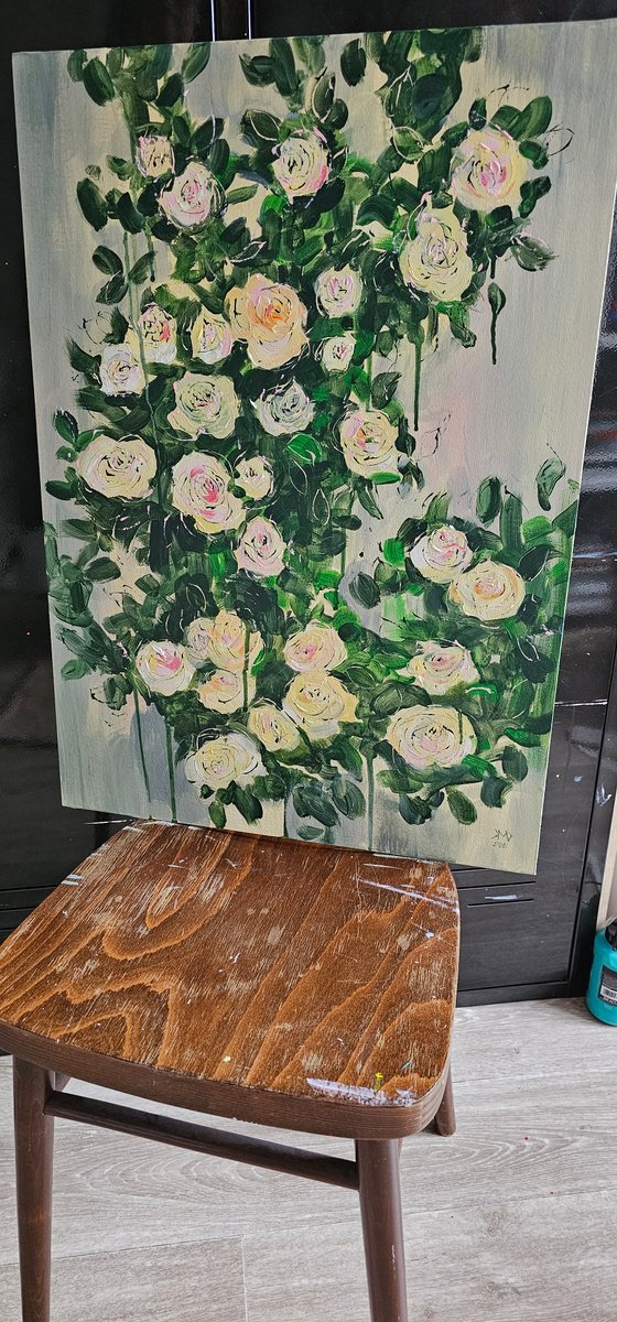 Blooming abstract rose garden in pale yellow