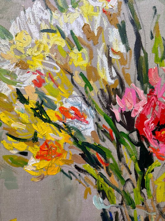 Tulips and daffodils in a glass vase