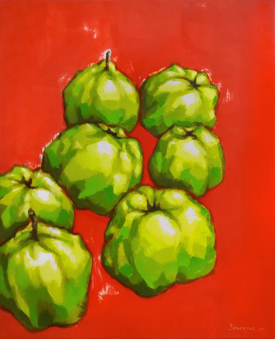 Green fruits on red background