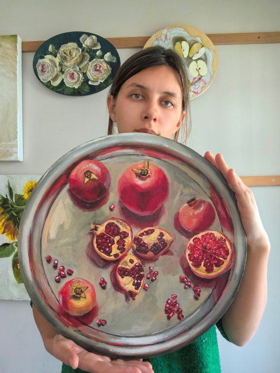 Pomegranates on metal try