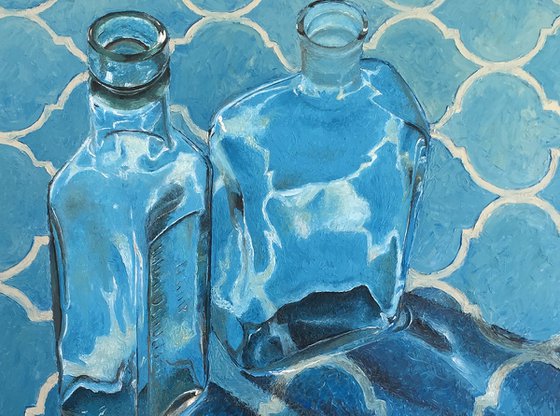 Vintage bottles on blue
