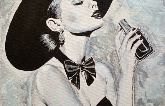 Woman with a bottle of perfume