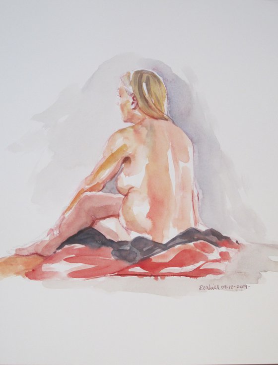 Seated female nude back view