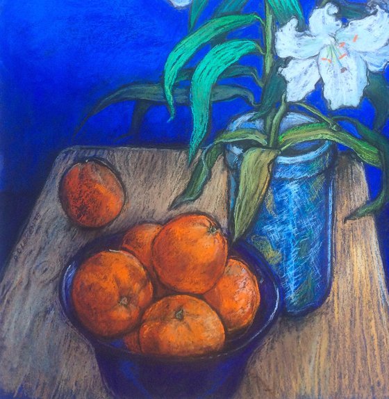 Lilly and oranges on a cobalt blue background