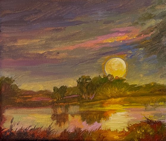 Evening moon over the lake