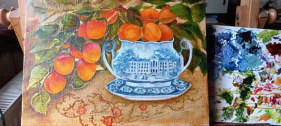 Apricot branch in a porcelain bowl