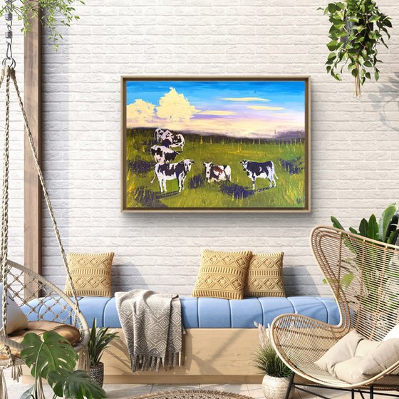 Cows grazing in the field