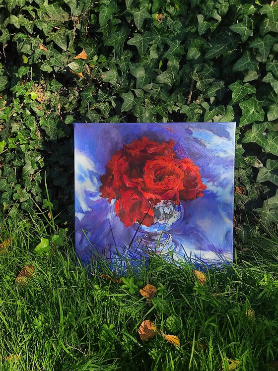Red roses in a metal vase