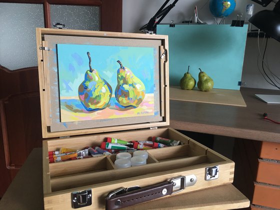 Two pears on a blue background