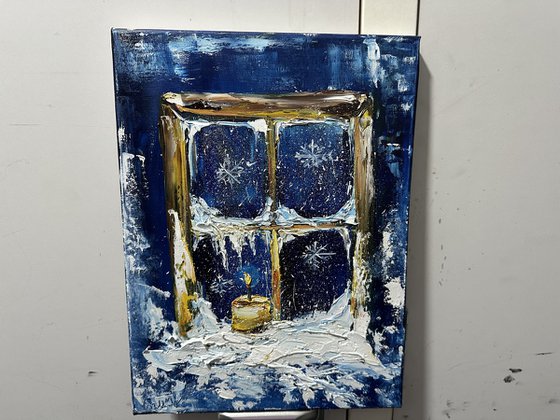 Winter window and candle